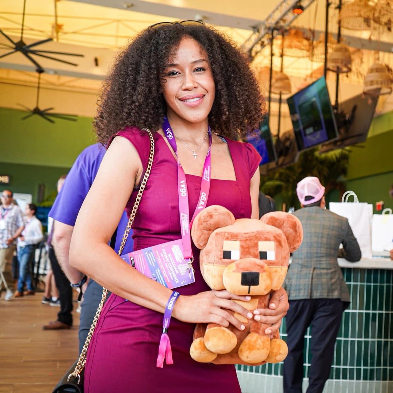 ArtsyMeta (@ArtsyMeta) at Blockchain Futurist Conference holding a Doginal Dogs plush